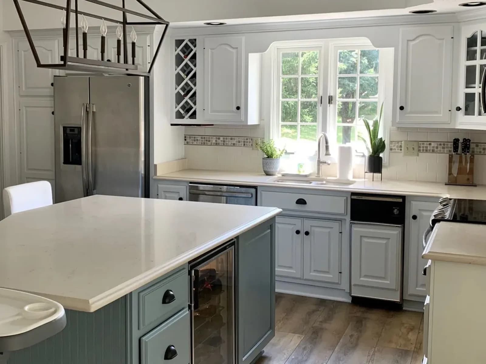 Cherry cabinets painted a soft gray-green, island included